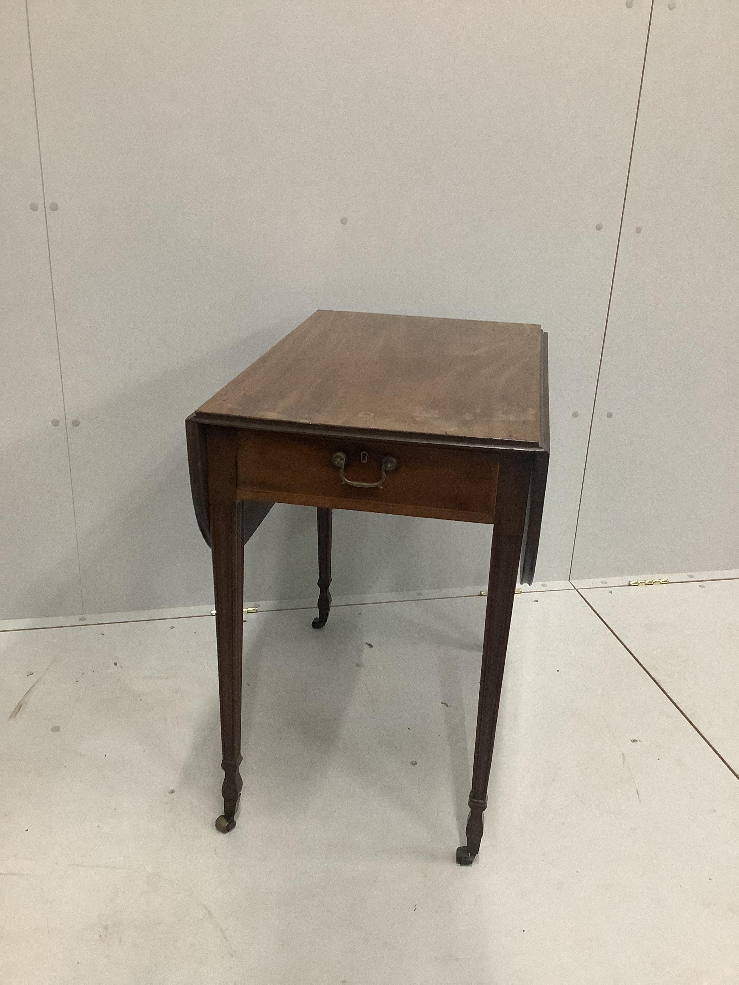 A George III mahogany Pembroke table with tapering square legs and brass castors, width 72cm, height 48cm